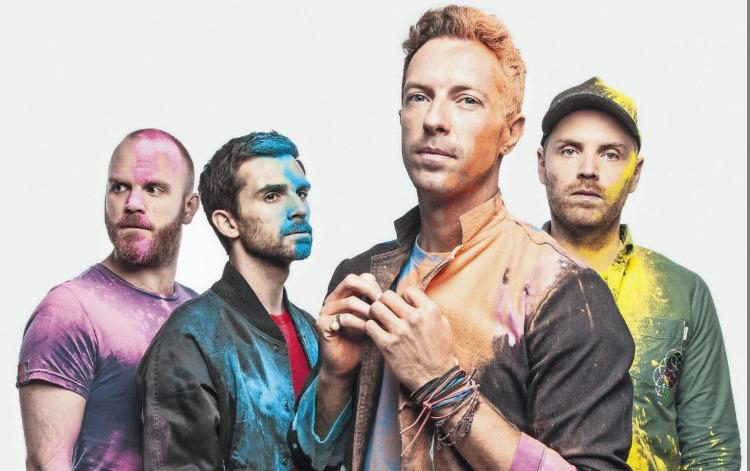 coldplay band covered in rainbow dust